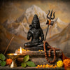 Handcrafted Shiva murti with trishul and crescent moon in a mandir niche with a diya