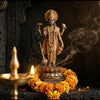 Handcrafted Vishnu murti with chakra, mace, conch and lotus in a mandir niche