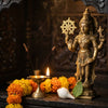 Handcrafted Krishna murti holding Sudarshan Chakra in a home mandir