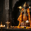 Handcrafted Vishnu murti holding the Sudarshan Chakra in a mandir niche with diyas and marigolds
